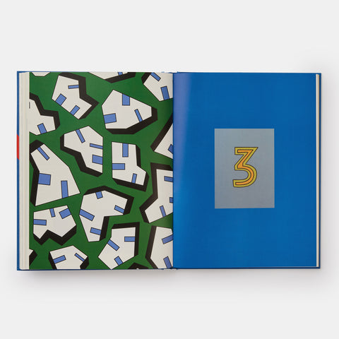 An open view of Phaidon's Hay Design book showing a bold abstract geometric pattern on one page and a blue page with a hand drawn number 3