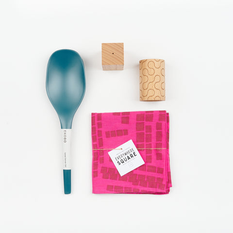 Areaware Pattern Salt and Pepper Shakers, a set of Blue Abyss colored Bamboo serving spoons, and a copper and hot pink abstract patterned Jenny Pennywood cotton linen Everywhere Square