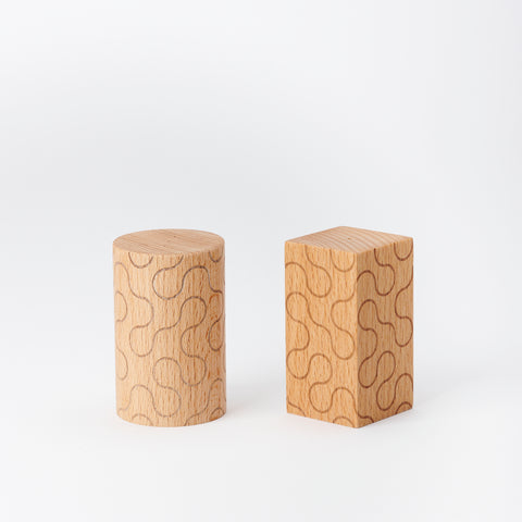 pair of wooden Areaware salt and pepper shakers for the table