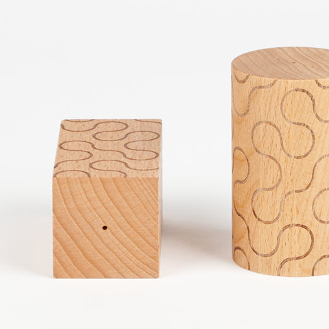 close up of the top and side of wooded salt and pepper shakers