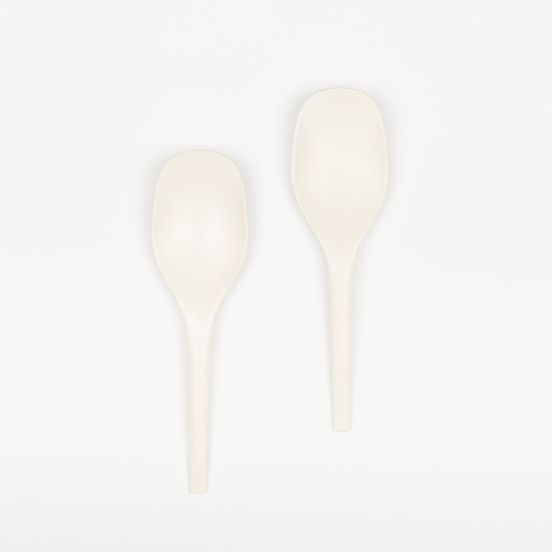 Pair of soft white EKOBO bamboo serving spoons.