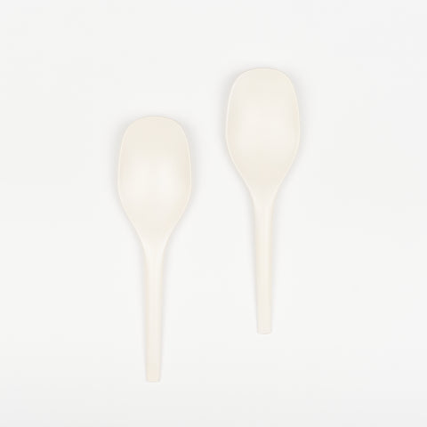 Pair of soft white EKOBO bamboo serving spoons.