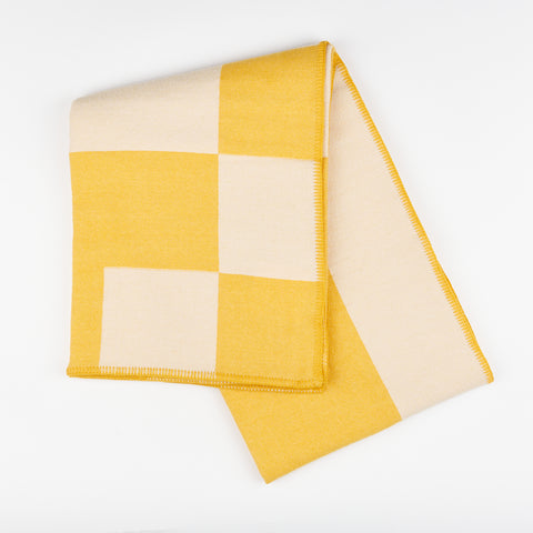 Manifatura wool throw blanket in Aspen color style - yellow and cream folded