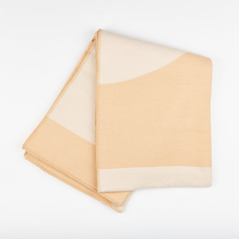 Manifatura wool throw blanket in Creama color style - pink and cream folded