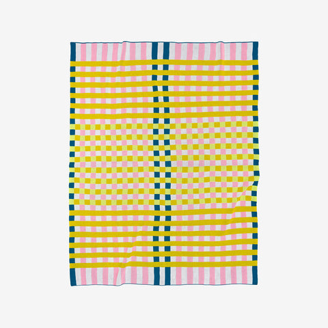 Verloop cotton knit throw with checkerboard pattern in poppy and cobalt laid flat