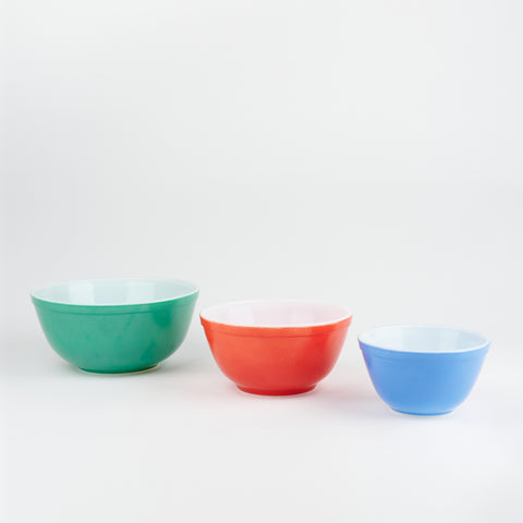 Set of three vintage Pyrex nesting bowls in green, red, and blue