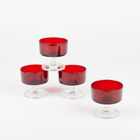 set of four glass dessert glasses with clear footed bases and dark red glass cups