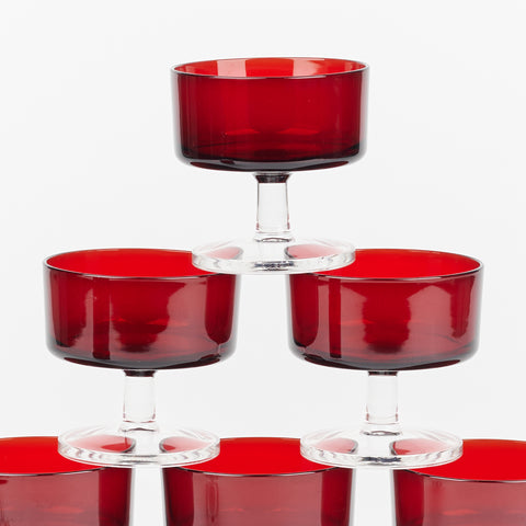 detail of stack of red glass dessert cups