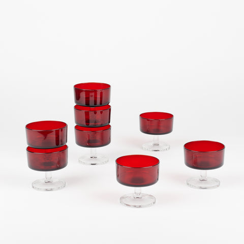 eight vintage dessert glass dishes with clear footed bases and dark red cups