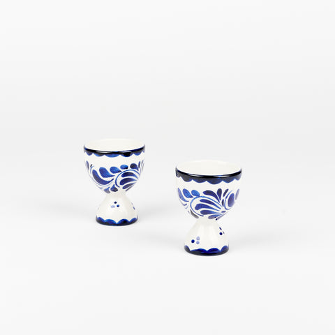 pair of vintage ceramic egg cups with blue and white decoration