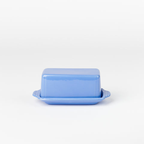 side view of periwinkle blue riviera ware butter dish shaped like a stick of butter
