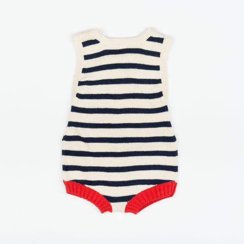 A the front of a cute striped nautical style baby romper