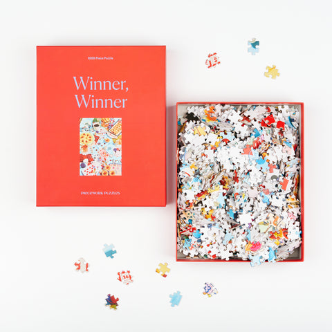open box view of Winner Winner puzzle showing top of the box and puzzle pieces inside