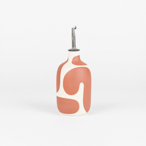 an animated image of a Franca oil cruet in canyon rotating to show the design in the round