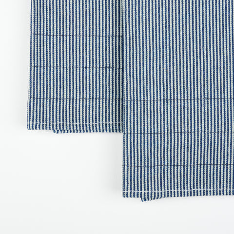 close up detail of a pair of hickory stripe tea towels with decorative stitching