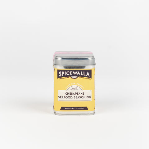 A square tin with rounded edges with bright yellow label containing Spicewalla Chesapeake Seafood Seasoning