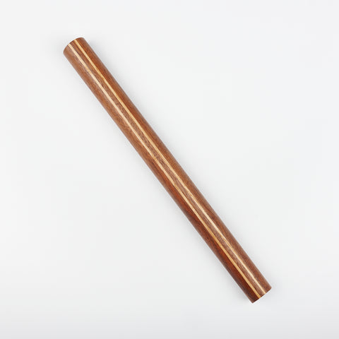 a walnut rolling pin with two lighter wood lines shown at a diagonal slant