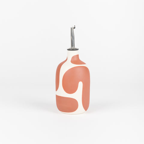 A ceramic vinegar or oil cruet with a brown geometric curving line design made by Franca