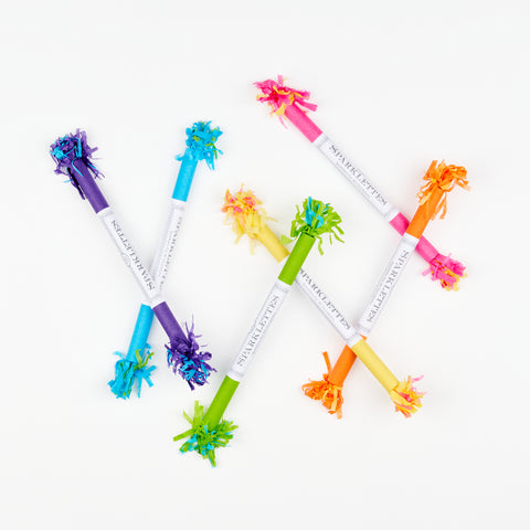 A colorful arrangement of TOPS Malibu sparklettes tubes in purple, blue, green, yellow, orange, and pink