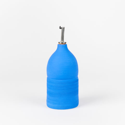 A handmade cobalt blue ceramic oil cruet
