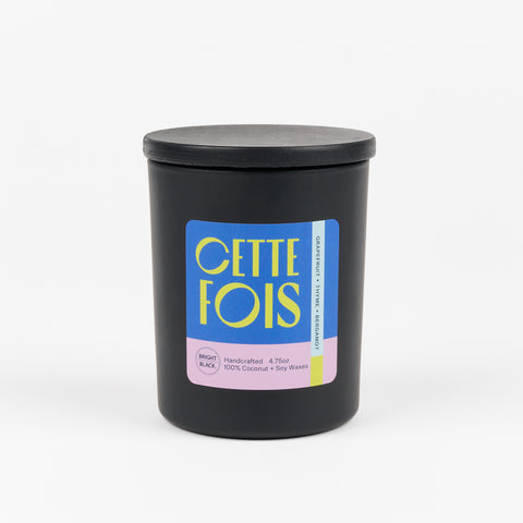 CETTE FOIS - a collaboration with Bright Black Candles is a scented candle in a black jar with scent notes of Grapefruit, Thyme, and Bergamot
