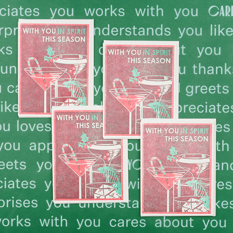 Set of four Heartell Press blank holiday note cards each with an illustration featuring cocktail glasses, a candy cane, and greenery