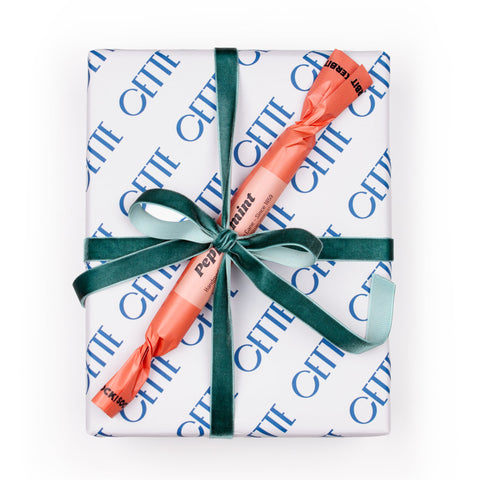 Peppermint Puzzling holiday gift set topped with Swedish peppermint stick, gift-wrapped with a velvet ribbon.