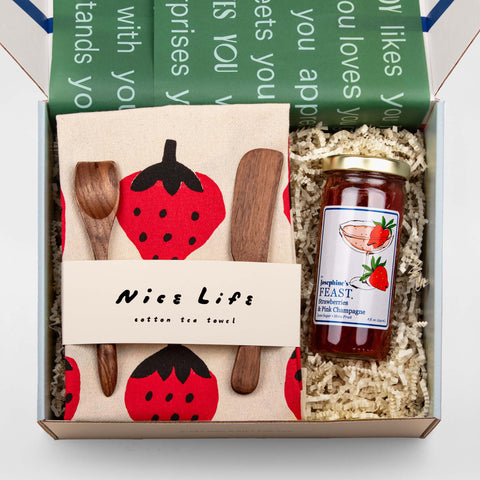 Open Jam On It (Strawberry) gift box displaying artisanal strawberry jam, tea towel, and walnut spreaders, beautifully arranged—ideal for thank you and host gifts.