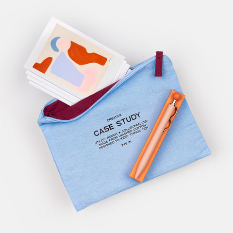 Creative Correspondence gift set with blue zipper pouch featuring burgundy interior, writing pen, and first set of four artist notecards with envelopes—perfect for thank you or thinking of you gifts.