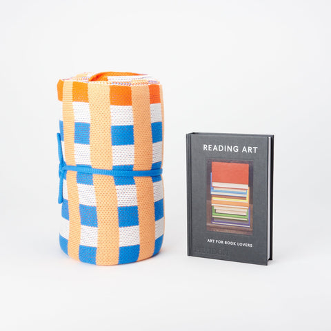 Phaidon book: Reading Art - Art for Book Lovers and Verloop Cotton Knit throw in Poppy and cobalt