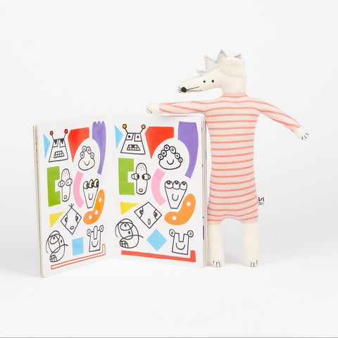 Phaidon Book the Game of Patterns open to show inside colorful illustrations and a Sophie Home Kids party mouse stuffed animal toy