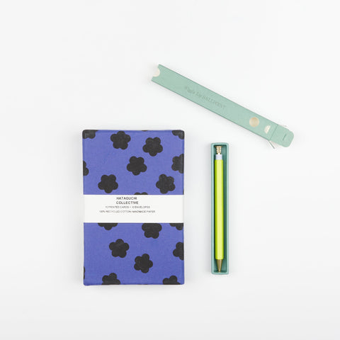 Hataguchi Handmade blank notes cards in a purple box and a Papier yellow wiggle top ballpoint pen in a pale green box