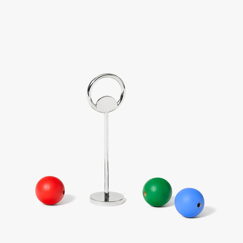Front view of the Areaware Abaco Bottle opener metal stand and its three colorful wooden balls on a white background, part of the Pop of Color gift set.