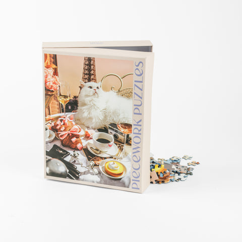 Puzzle box with a french bistro scene and white cat