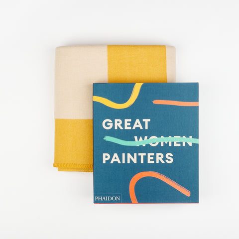 A Manifatura yellow wool blanket and Phaidon's Art book Great Women Painters