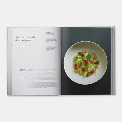 open view of cookbook On Vegetables showing a recipe and a colorful vegetarian dish