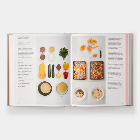 open book view of Phaidon Cookbook Simple & Classic showing a recipe, instructions, and an orderly presentation of cut ingredients