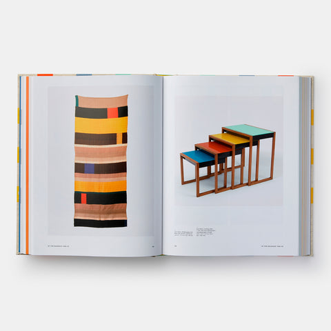 Phaidon art book Josef and Anni Albers open and showing pages with pictures of a geometric wall tapestry and a set of nesting tables
