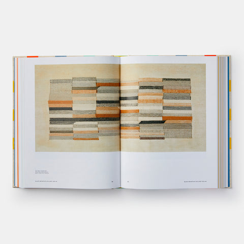 open book showing a picture of an abstract wall weaving by Anni Albers