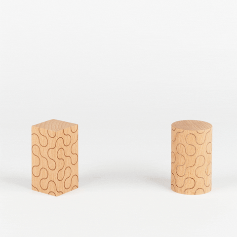 an animated gif of two Areaware wooden pattern salt and pepper shakers moving close and away from each other