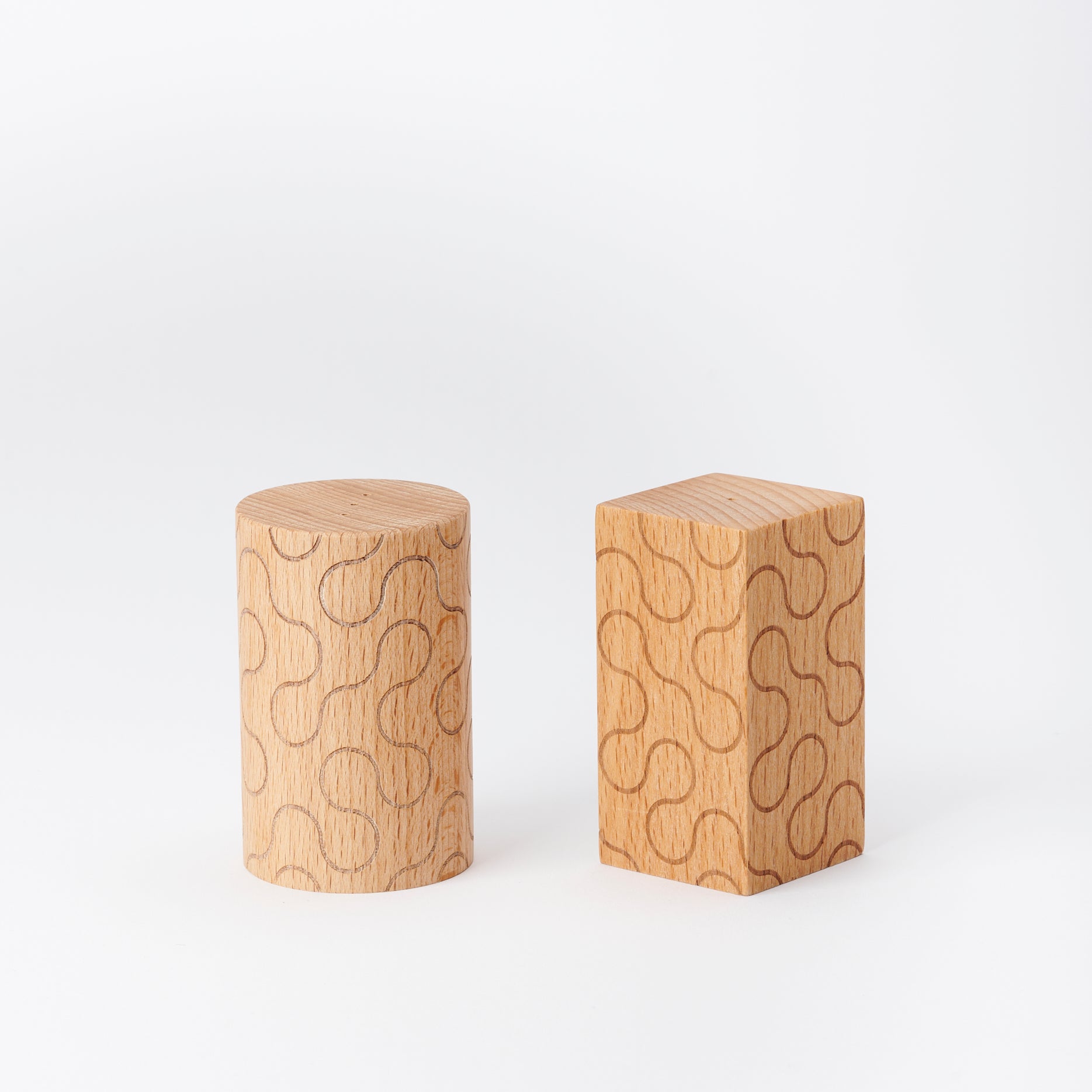 pair of wooden Areaware salt and pepper shakers for the table