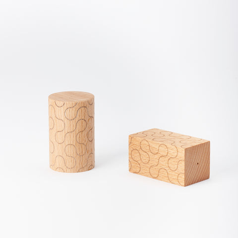 one round and one square shaped wooden salt and pepper shaker pair