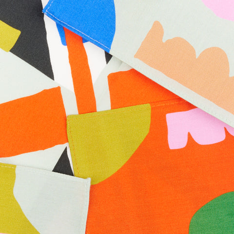 a close up view of a set of colorful napkins with a pattern of shapes