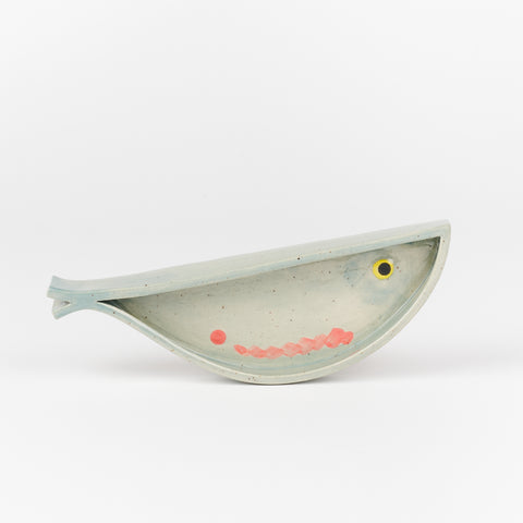 A handmade ceramic dish in the shape of a fish