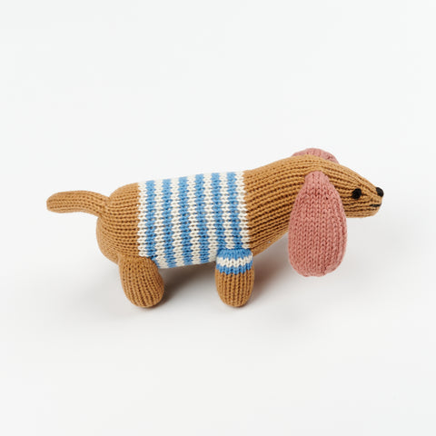 organic knit baby rattle in the shape of a small dog with long ears and a striped blue and white sweater