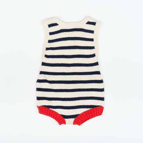 A the front of a cute striped nautical style baby romper 