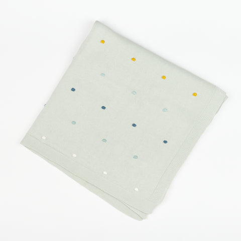 a folded Viverano Organics Jacquard knit baby blanket with stitched dot accents 