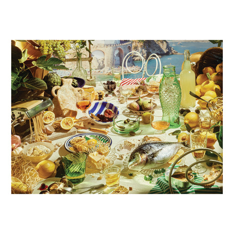 Bloom Boom puzzle picture showing an elaborate tablescape with fish, lemons, pasta, olives, and colorful glassware