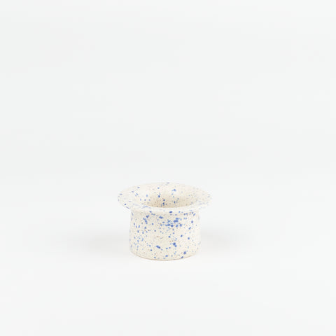 a blue speckle ceramic tea strainer handmade by Utility Objects standing upright