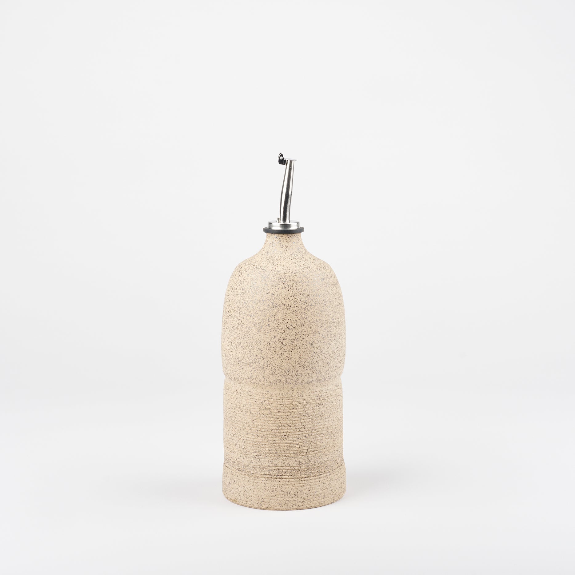 Utility Objects ceramic oil cruet in sand